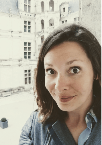 white woman with dark shoulder length hair